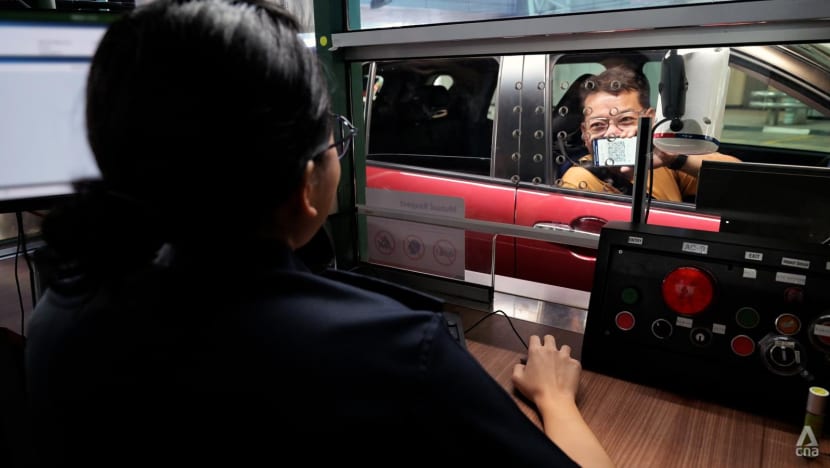 driver%20showing%20ICA%20officer%20qr%20code%20woodlands%20checkpoint%20july%2029%202024