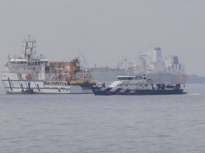 A Singapore Police Coast Guard vessel engaging a Malaysian government vessel in the sea off Tuas View Extension at around 3pm on Thursday, December 6, 2018.