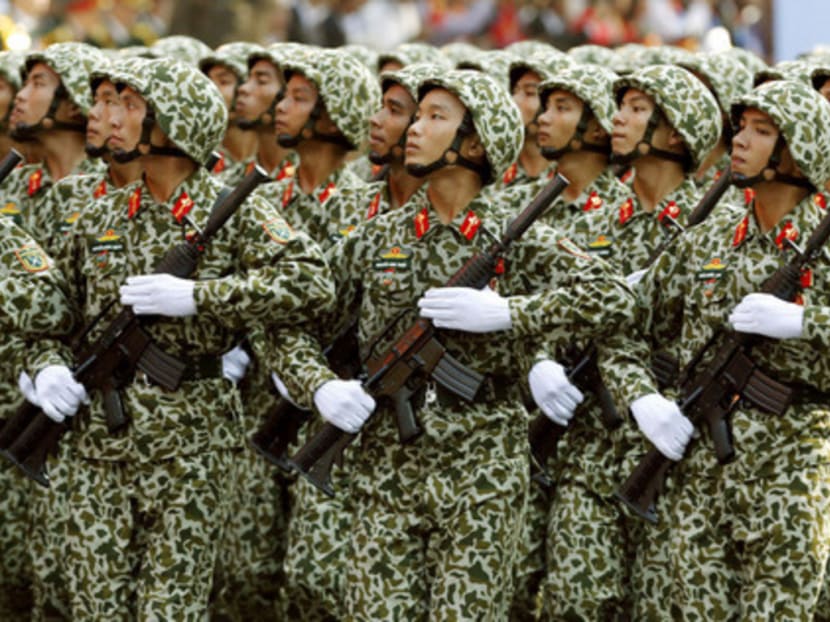 Vietnamese soldiers in Ho Chi Minh City on April 30 at a parade for the 40th anniversary of the fall of Saigon. The US is providing Vietnam with six patrol boats, part of a US$18-million military aid package.  PHOTO: REUTERS