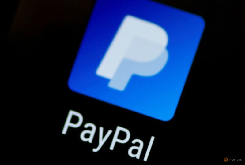 FILE PHOTO: The PayPal app logo seen on a mobile phone in this illustration photo October 16, 2017. REUTERS/Thomas White/Illustration FILE PHOTO: The PayPal app logo seen on a mobile phone in this illustration photo October 16, 2017. REUTERS/Thomas White/Illustration