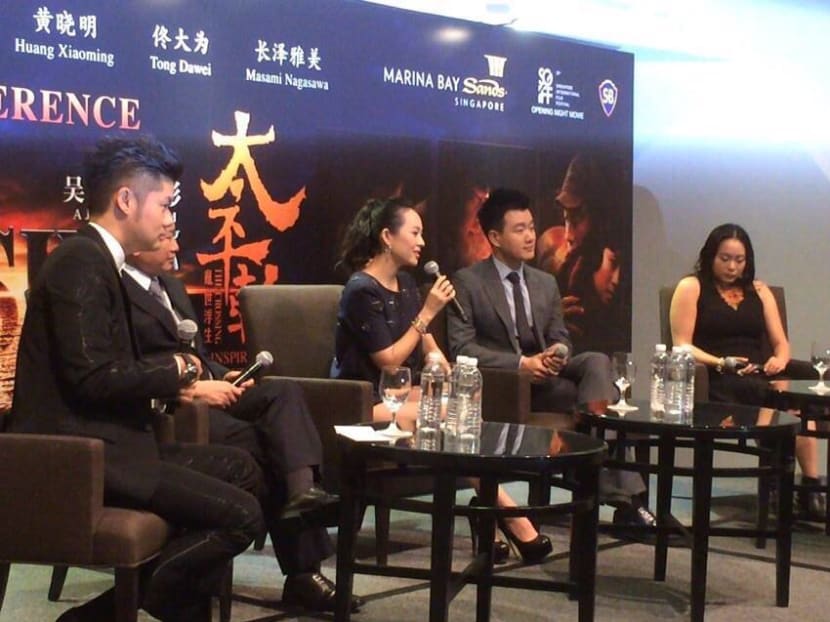 Stars of John Woo's film The Crossing, Zhang Ziyi and Tong Dawei are in Singapore, along with the film's director, for the opening of the Singapore International Film Festival tonight. Photo: Geneieve Teo