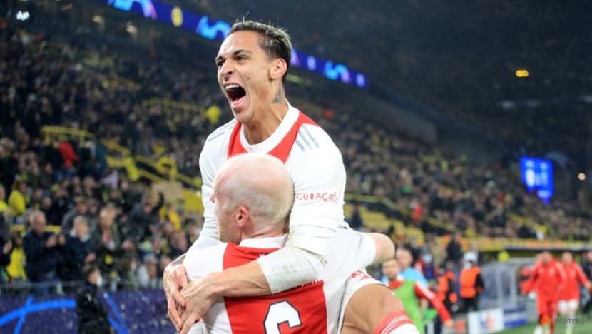Ajax win at Dortmund to qualify for last 16 Ajax win at Dortmund to qualify for last 16