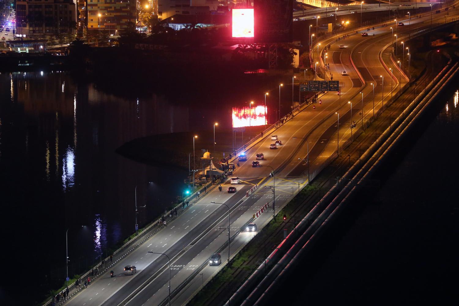 Vehicles making their way across the Causeway in the early hours of April 1, 2022. Vehicles making their way across the Causeway in the early hours of April 1, 2022.