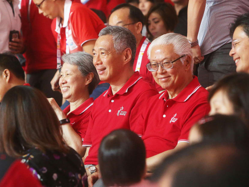 The President (right) and PM Lee at the netball final. Photo: Ooi Boon Keong