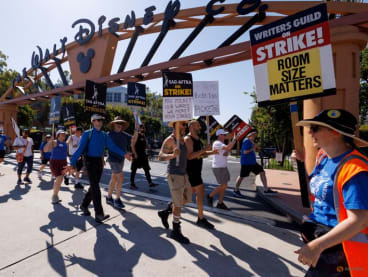 SAG-AFTRA actors and Writers Guild of America (WGA) writers walk the picket line outside Disney Studios in Burbank, California, US, on  July 25, 2023.