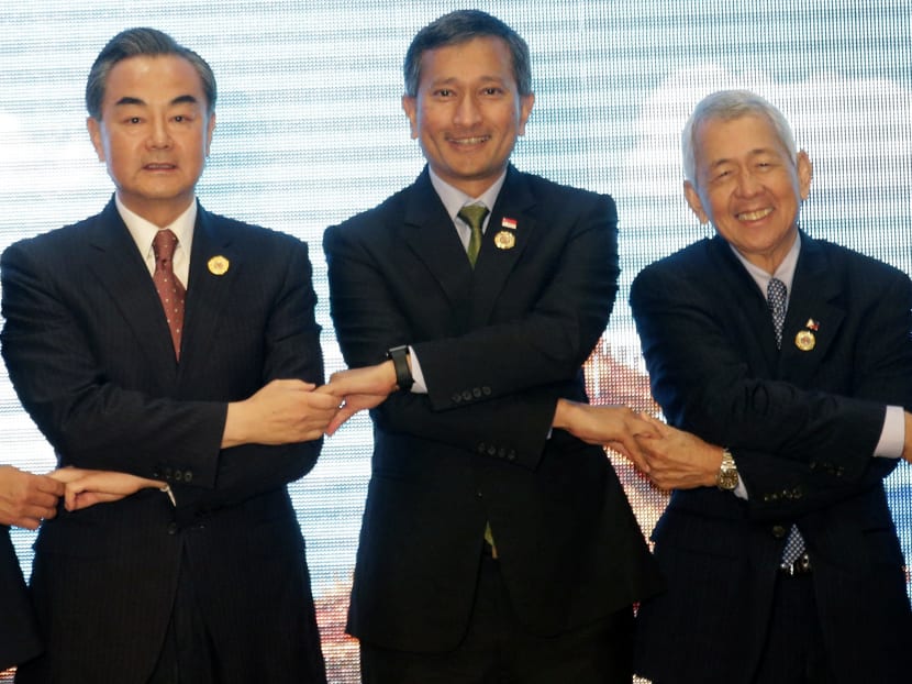 From left to right: Chinese Foreign Minister Wang Yi, Singapore's Foreign Minister Vivian Balakrishnan, Philippine Foreign Minister Perfecto Yassay, at the Association of Southeast Asian Nations (ASEAN) –China Foreign Ministers' Meeting in Vientiane, Laos, Monday, July 25, 2016. PHOTO: AP