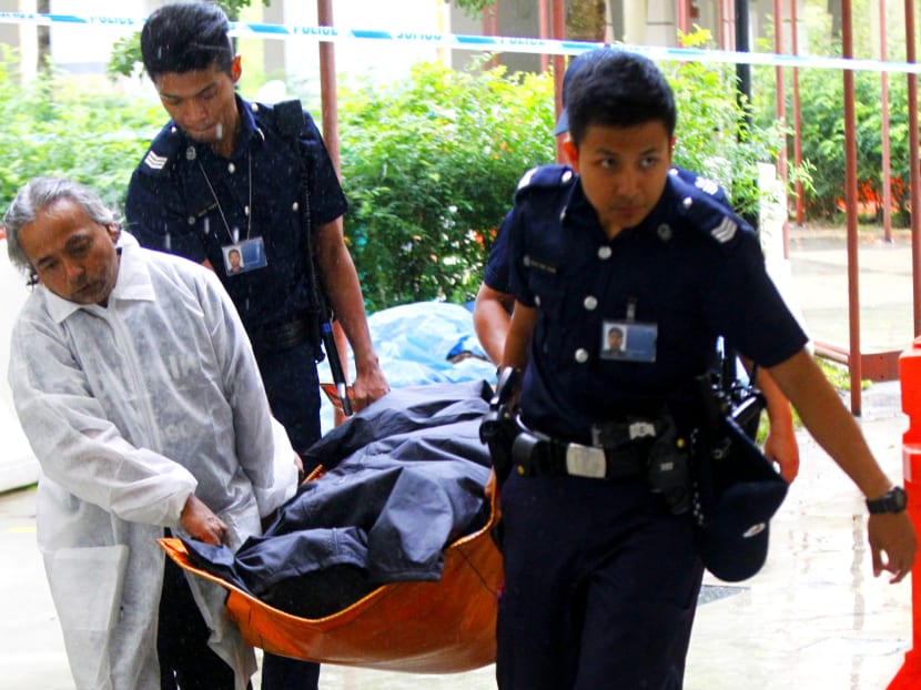 Police remove the bodies from Ang Mo Kio Avenue 4, Block 105 on June 4, 2014. TODAY file photo