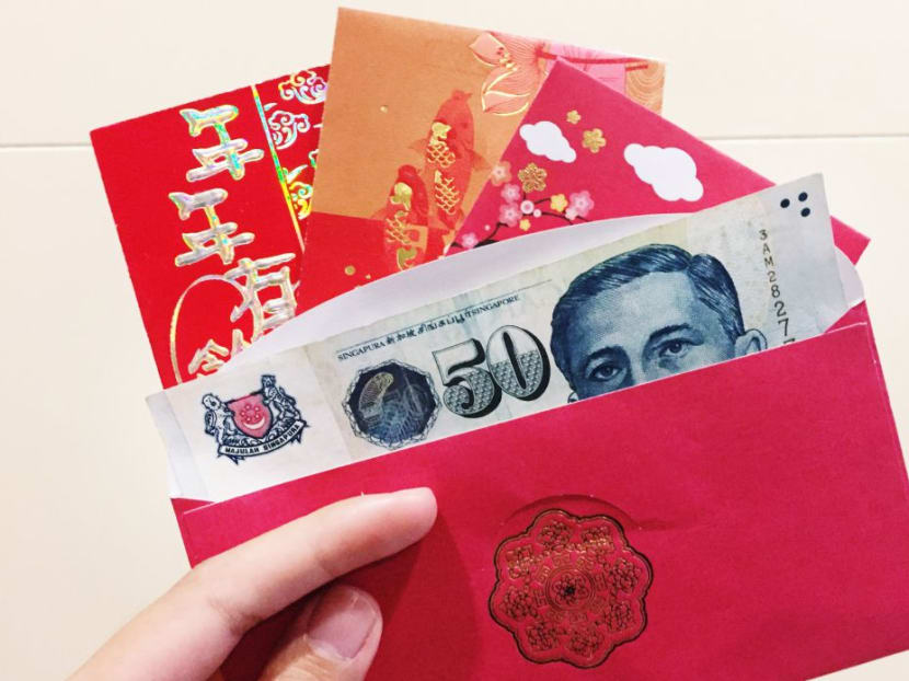 It is customary for the Chinese to give each other hongbao — or a red packet containing money — during the festival, which begins this year on Friday (Feb 16). TODAY file photo