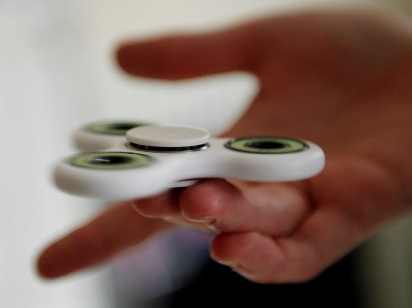The fidget spinner has proved to be a surprise hit among children, but teachers aren't having any of it. Photo: Reuters