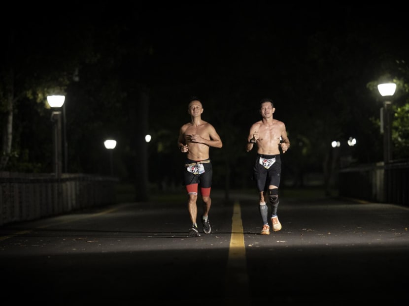 Joshua Toh (left) and Deric Lau running through the night during the Backyard Ultra World Team Championships held between Oct 15 and Oct 17, 2022. Joshua Toh (left) and Deric Lau running through the night during the Backyard Ultra World Team Championships held between Oct 15 and Oct 17, 2022.