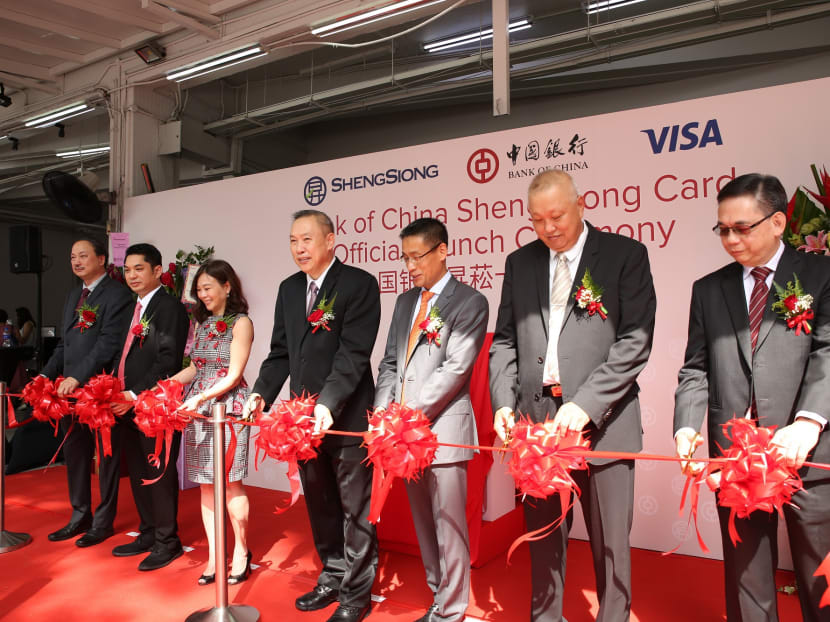 Mr Lim Hock Chee, the CEO of Sheng Siong Group (centre), with other heads from Bank of China and Sheng Siong at the launch of the new credit card. Photo: Sheng Siong