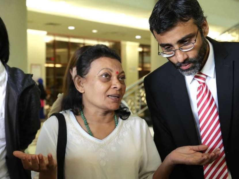 Mrs V Eswary (centre), seen here with lawyer M Surendran, filed the judicial review at a High Court in Kuala Lumpur. Photo: Malay Mail Online