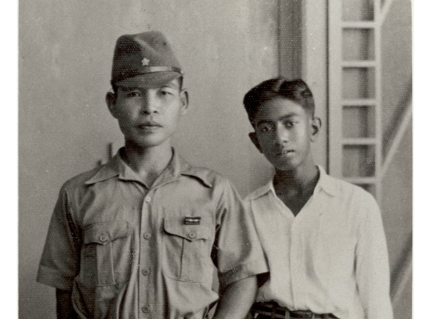 Mr SR Nathan (right) seen here with a Japanese officer during World War II. Mr Nathan was an interpreter during the war. Photo: Mr Nathan's personal collection.