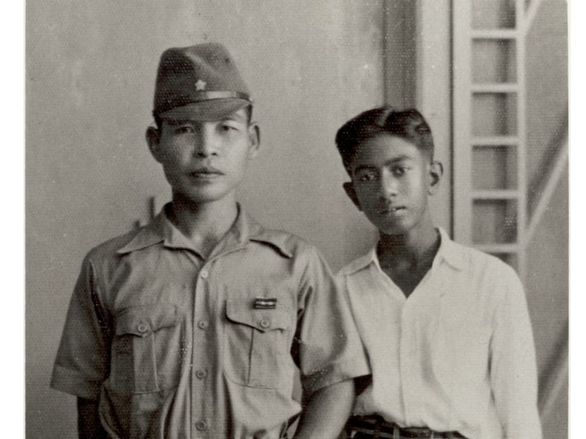 Mr SR Nathan (right) seen here with a Japanese officer during World War II. Mr Nathan was an interpreter during the war. Photo: Mr Nathan's personal collection. Mr SR Nathan (right) seen here with a Japanese officer during World War II. Mr Nathan was an interpreter during the war. Photo: Mr Nathan's personal collection.