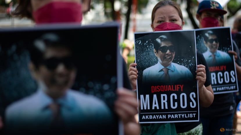 Philippines poll body dismisses bids to disqualify frontrunner Marcos Philippines poll body dismisses bids to disqualify frontrunner Marcos