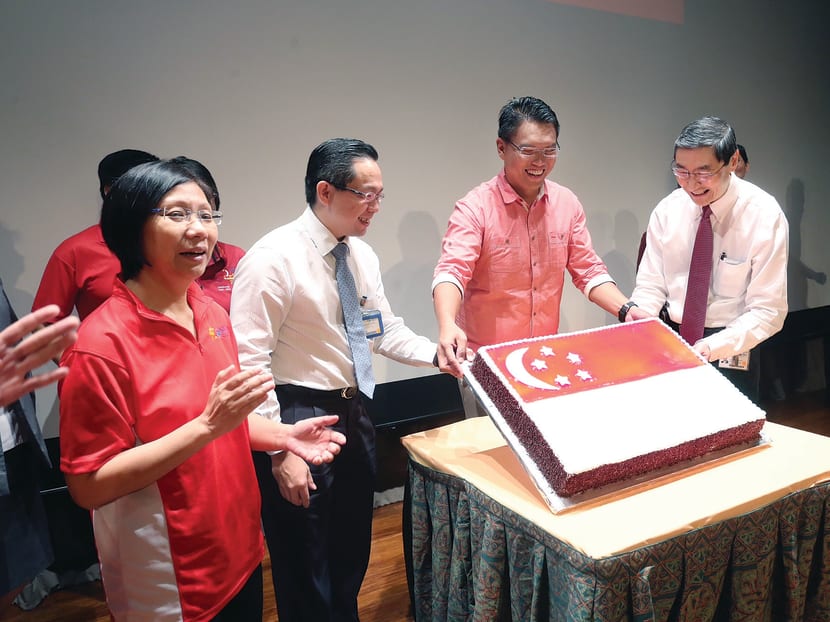 At the National Day Observance Ceremony yesterday (from left): Ms  Diana Chia, president of NTUC; adjunct associate professor Joe Sim, chief executive officer of NUH; Mr Patrick Tay, assistant secretary-general of NTUC; and Professor John Wong, chief executive of National University 
Health System. PHOTO: NATIONAL TRADES 
UNION CONGRESS