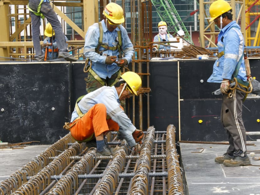 Construction workers working at a construction site, 15 Jan, 2014. Photo: Ernest Chua/TODAY