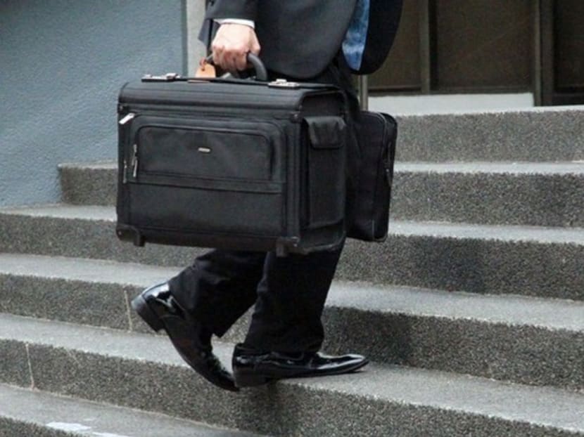 A lawyer making his way to a court in Singapore. Photo: Channel NewsAsia