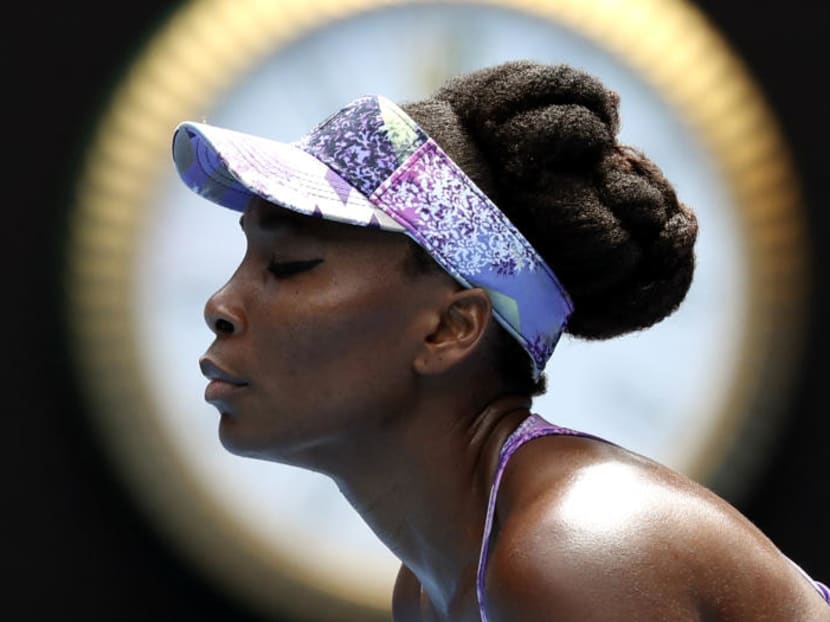 Venus Williams pauses while playing compatriot Coco Vandeweghe during their semi-final at the Australian Open. Doug Adler, a tennis commentator dropped by ESPN for a remark about Venus Williams during the Australian Open has sued the network for wrongful termination. Adle maintains he was describing Williams' aggressive style last month as 'guerrilla' tactics and not comparing her with a 'gorilla.' Photo: AP