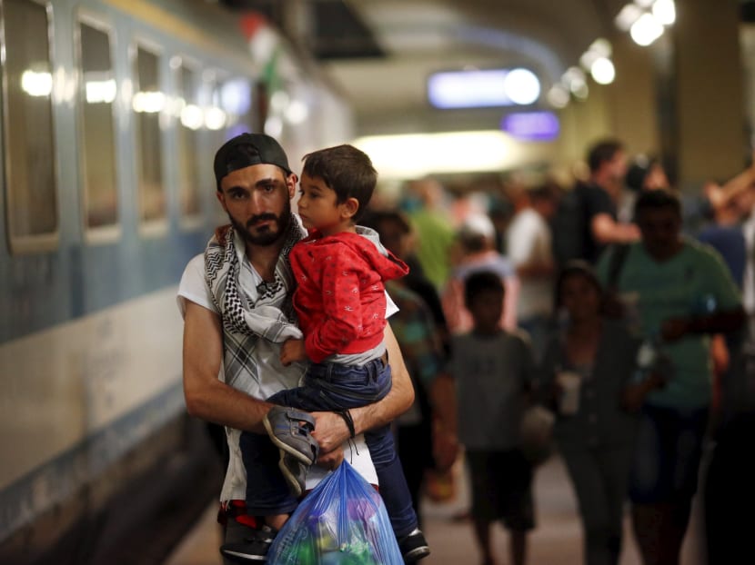 Travellers believed to be migrants leave a train coming from Hungary at the railway station in Vienna, Austria, Sept 1, 2015. Trainloads of migrants arrived in Austria and Germany from Hungary on Monday as European Union asylum rules collapsed under the strain of a wave of migration unprecedented in the EU. Photo: REUTERS