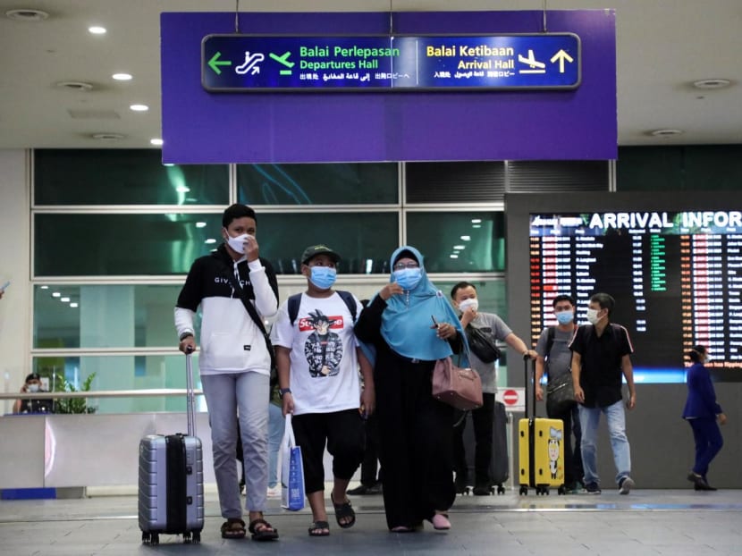 Travellers walk at Kuala Lumpur International Airport 2 in Malaysia on April 1, 2022.