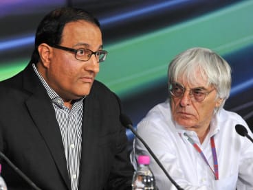 Singapore minister of trade and industry S Iswaran (L) speaks while Formula One rights-holder Bernie Ecclestone (R) looks on during a press conference at Formula One's Singapore Grand Prix night race in Singapore on Sept 22, 2012.