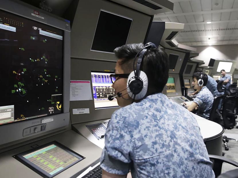 Personnel involved in the RSAF’s Exercise Vigilant Shield 2016 at the Singapore Air Traffic Control Centre on Monday (Nov 28). The RSAF said it takes air threats issued through social media channels, including bomb threats, ‘quite seriously’. Photo: Wee Teck Hian/TODAY
