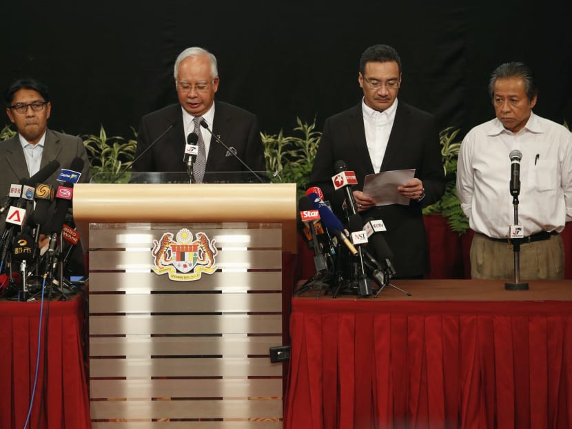 Malaysia's Prime Minister Najib Razak (2nd left) makes an announcement on the latest development on the missing Malaysia Airlines MH370 plane at Putra World Trade Center in Kuala Lumpur March 24, 2014.  Photo: Reuters