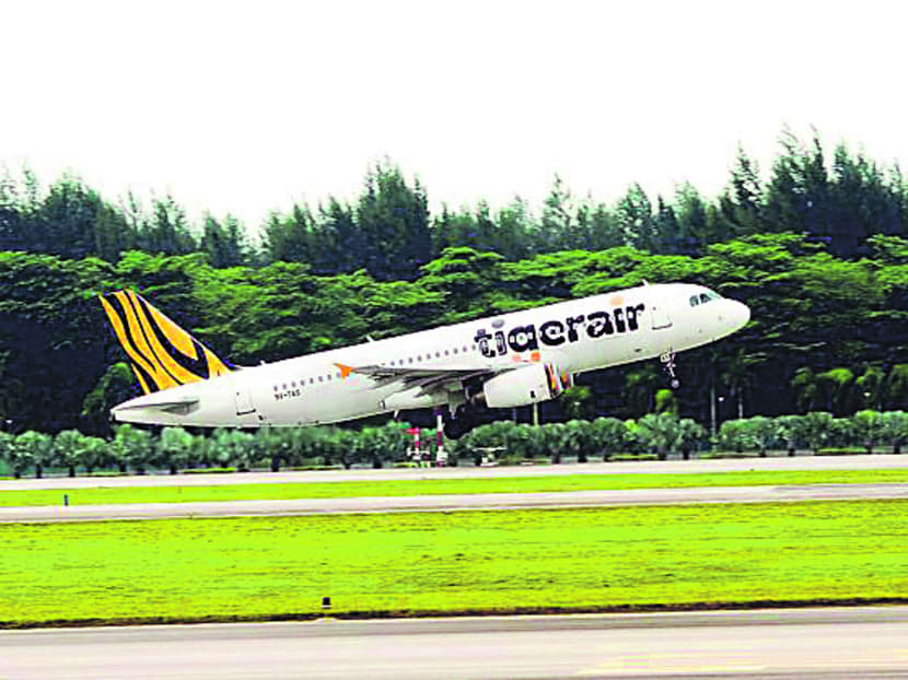 Tiger reported yesterday a net loss of S$65.2 million in the first quarter ended June, an increase from the S$32.8 million loss suffered in the year-ago period. Photo: Tigerair