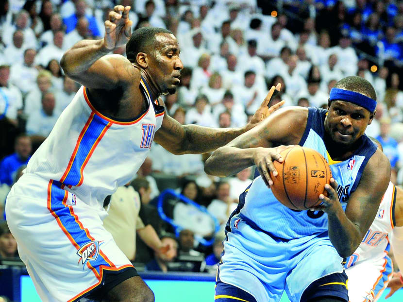 Memphis Grizzlies forward Zach Randolph (right) drives to the basket against Oklahoma City Thunder centre Kendrick Perkins during the first quarter in Game 2 in the first round of the 2014 NBA Playoffs at Chesapeake Energy Arena. Photo: USA TODAY Sports