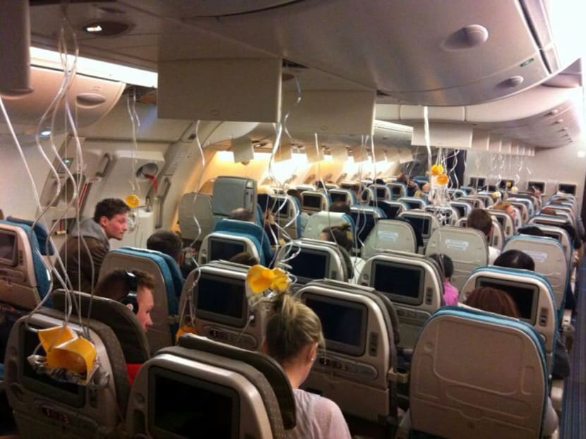 The cabin of flight SQ317, with oxygen masks deployed on Jan 6, 2013.