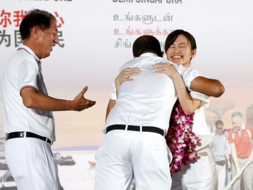 PAP candidate Tin Pei Ling (right) being congratulated by colleagues Janil Puthucheary and Deputy Prime Minister Teo Chee Hean after her win in MacPherson SMC. Photo: Raj Nadarajan
