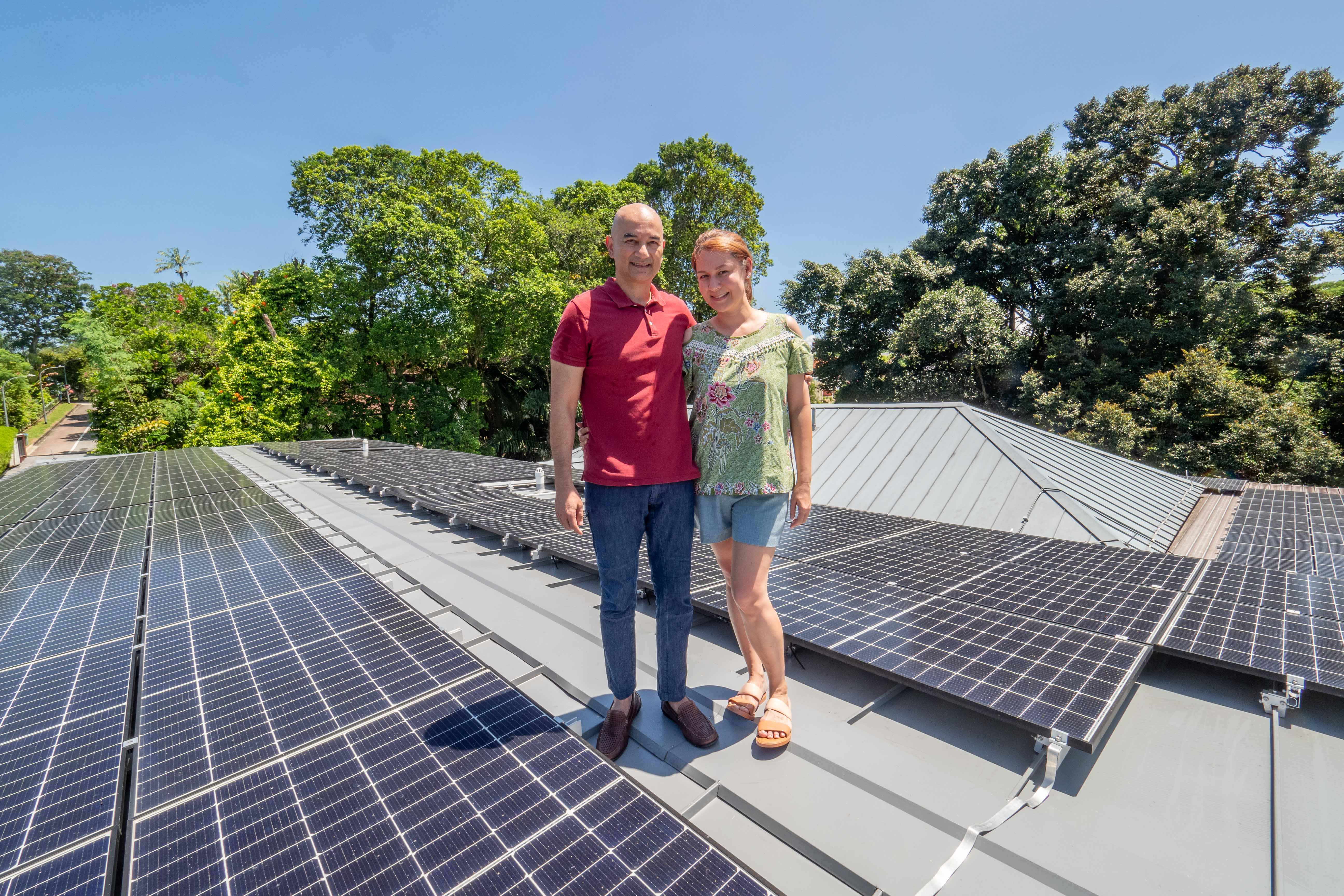 Mr Arun Murthy and his wife, Mrs Sheryl Arun Murthy, pose for a photo on May 12, 2022. In March this year, 100 solar panels were installed on the roof of their house. 