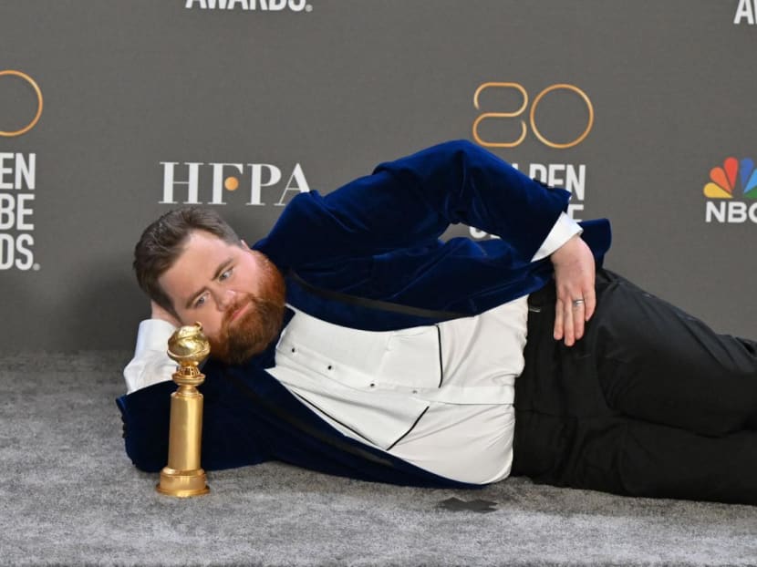 US actor Paul Walter Hauser poses with the award for Best Supporting Actor - Television Limited Series/Motion Picture for "Black Bird" in the press room during the 80th annual Golden Globe Awards at The Beverly Hilton hotel in Beverly Hills, California, on Jan 10, 2023.
