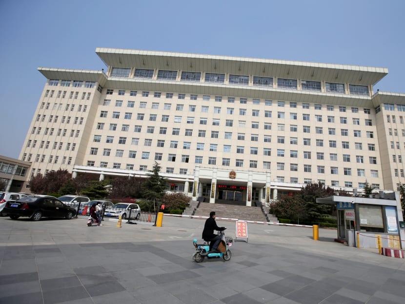A resident drives a motorbike in front of the government building of Xiongxian county, one part of the new special economic zone Xiong'an New Area, Hebei province, China April 3, 2017. Photo: Reuters