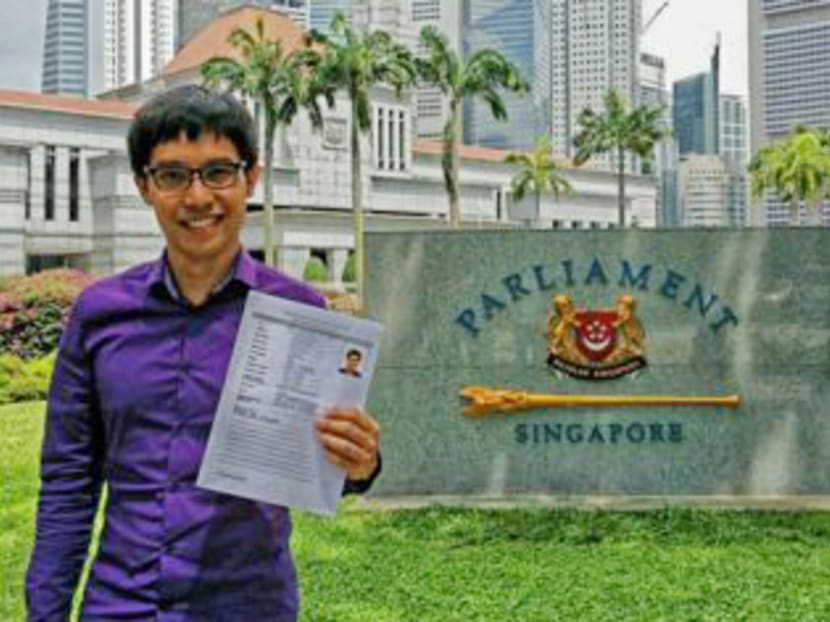 Mr Roy Ngerng is seen here holding his application to be a Nominated Member of Parliament. Photo: Roy Ngerng's Facebook page.