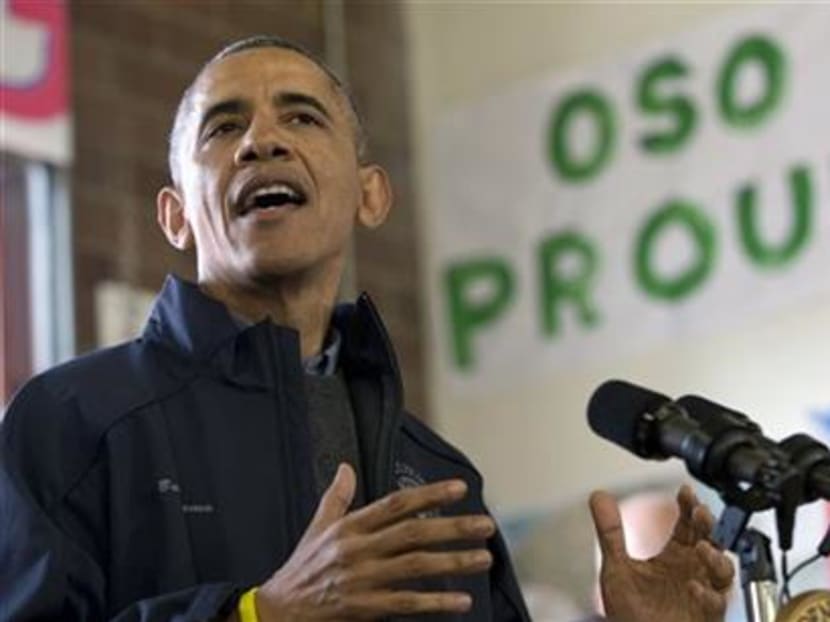 President Barack Obama speaks to first responders, recovery workers and community members at the Oso Fire Department in Oso, Washington onTuesday, April 22, 2014, the site of the deadly mudslide that struck the community in March. Photo: AP