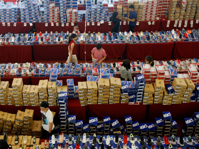 Malaysians shop for shoes at a mall in Johor Baru. Self-gratification and funding their hobbies take priority over shoring up savings for many urban Malaysian millennials who lack financial planning know-how, but don’t appear to be perturbed by it. Photo: Reuters
