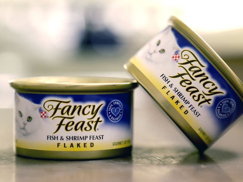 This Monday, Nov. 16, 2015, photo shows Fancy Feast cat food, fish and shrimp feast flavor, a product of Thailand, purchased at a Publix market in Orlando, Fla. A report commissioned by Nestle SA found that impoverished migrant workers in Thailand are sold or lured by false promises and forced to catch and process fish that ends up in the global food giant’s supply chains. Photo: AP