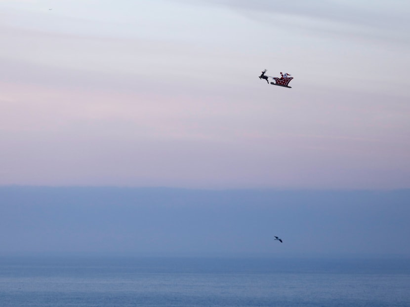 Photo of the day: A 3-metre long remote controlled flying Santa makes a test flight over the ocean in Carlsbad, California, US. Photo: Reuters