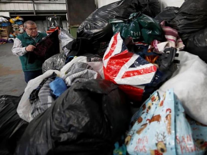 Height of fashion? Clothes mountains build up as recycling breaks down Height of fashion? Clothes mountains build up as recycling breaks down