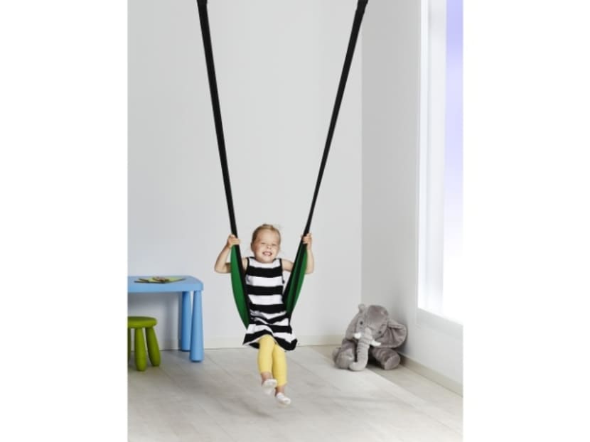 A child using IKEA's GUNGGUNG children's swing. Photo: IKEA Singapore