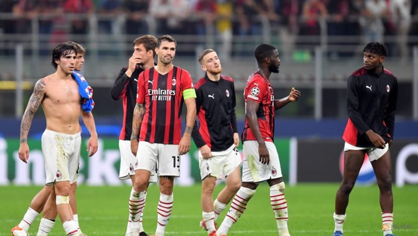 Last-gasp Suarez penalty earns Atletico victory over 10-man Milan Last-gasp Suarez penalty earns Atletico victory over 10-man Milan