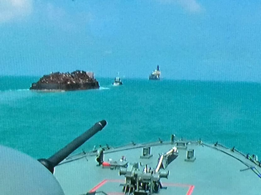 The RSS Resilience (foreground) escorting the Permata 1. Photo: MINDEF