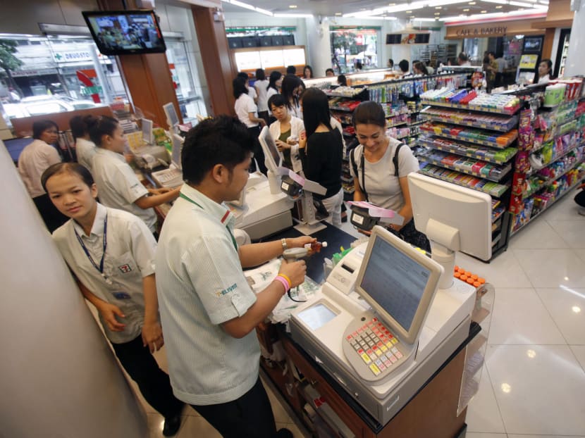 Customers buy goods at a 7-Eleven store in Bangkok. The convenience store chain is set to roll out state-of-the-art artificial intelligence technologies, including facial and gesture recognition and behaviour analysis of customers and employees. Photo: Reuters