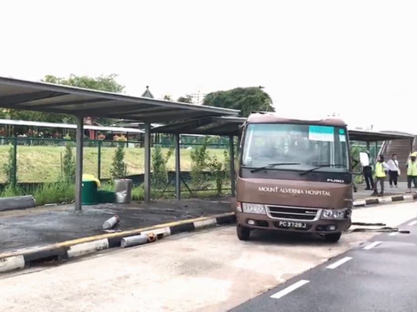 Thirteen people were injured after a minibus drove into a bus stop along Braddell Road (in the direction towards Bishan) at 12.10pm on Wednesday (July 26). Photo: Jason Quah/TODAY