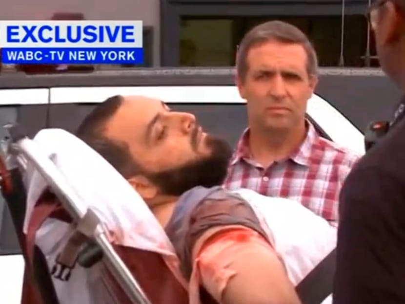 A still image captured from a video from WABC television shows a conscious man believed to be New York bombing suspect Ahmad Khan Rahami being loaded into an ambulance after a shoot-out with police in Linden, New Jersey, on Sept 19, 2016. Photo: WABC-TV via Reuters