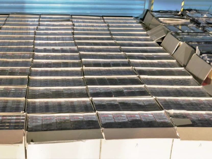 Singapore Customs officers conducted an operation in the vicinity of the Jurong Port on March 30, 2016. They recovered a total of 10,500 cartons of duty-unpaid cigarettes from a white truck. Photo: Singapore Customs