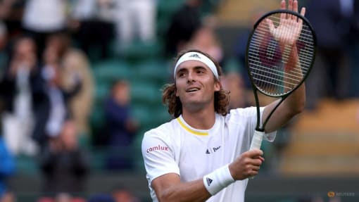 Tsitsipas wriggles out of trouble to reach Wimbledon second round