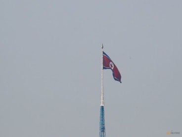 A North Korean flag flutters on top of the 160m tall tower at North Korea's propaganda village of Gijungdong, in this picture taken from Tae Sung freedom village near the Military Demarcation Line (MDL), inside the demilitarised zone separating the two Koreas, in Paju, South Korea, on Sept 30, 2019.